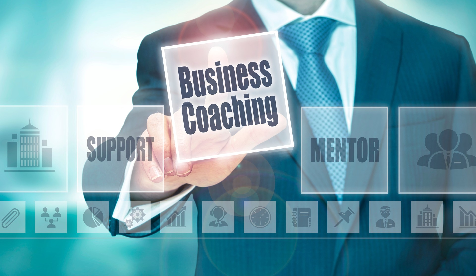 A businessman selecting a Business Coaching Concept button